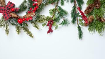 Christmas fir branches with decor on a white background, top view photo