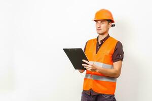 Male real estate agent with clipboard on grey background photo