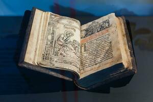 Ukraine, Kiev - February 2, 2020 Interior of exhibition ukraine wow. The Apostle is one of the first printed books in Ukraine in 1574 photo