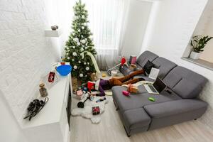 Man after heavy christmas partying at home photo