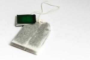 Teabag with label. Top view. Isolated on a white. mockup photo