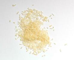 Pile of white glutinous rice isolated on white background. Top view. photo