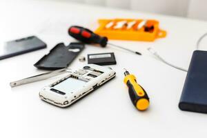 Smart phone repair isolated on white background. photo