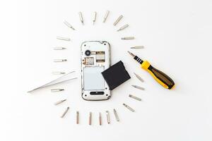 Smart phone repair isolated on white background. photo