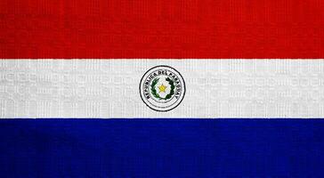 Flag of Republic of Paraguay on a textured background. Concept collage. photo