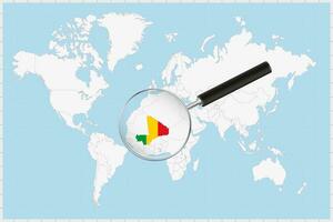 Magnifying glass showing a map of Mali on a world map. vector