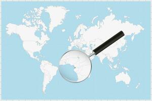 Magnifying glass showing a map of Equatorial Guinea on a world map. vector