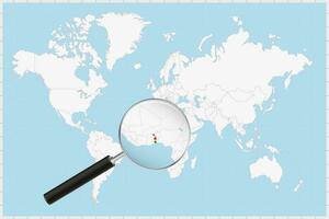 Magnifying glass showing a map of Togo on a world map. vector