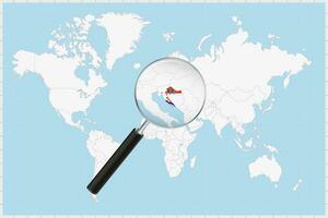 Magnifying glass showing a map of Croatia on a world map. vector