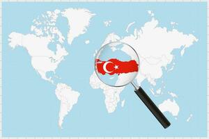 Magnifying glass showing a map of Turkey on a world map. vector