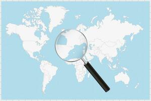 Magnifying glass showing a map of Andorra on a world map. vector