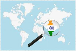 Magnifying glass showing a map of India on a world map. vector