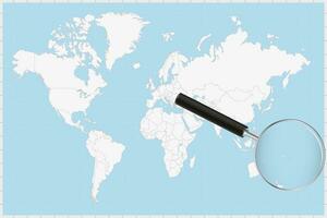 Magnifying glass showing a map of Tonga on a world map. vector