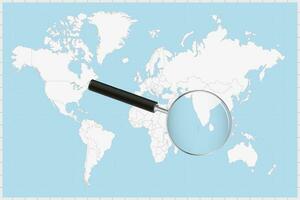 Magnifying glass showing a map of Maldives on a world map. vector