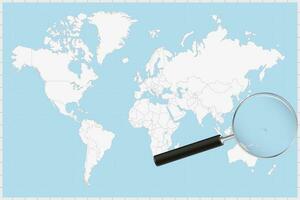 Magnifying glass showing a map of Marshall Islands on a world map. vector