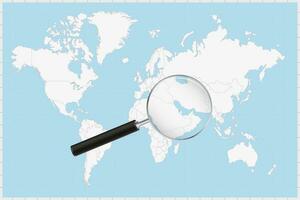 Magnifying glass showing a map of Bahrain on a world map. vector