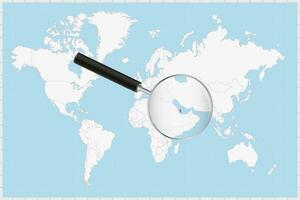 Magnifying glass showing a map of Qatar on a world map. vector