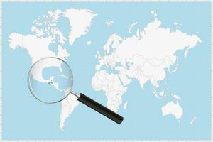 Magnifying glass showing a map of Guatemala on a world map. vector