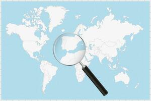 Magnifying glass showing a map of Gibraltar on a world map. vector