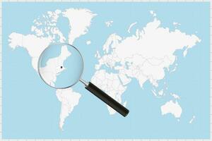 Magnifying glass showing a map of Massachusetts on a world map. vector