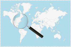 Magnifying glass showing a map of Rhode Island on a world map. vector