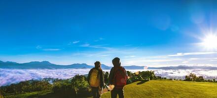 Young couple Camping Hiking Journey Travel Trek Concept, Holiday travel,  Travel relax, Natural Touch countryside, in Thailand. photo