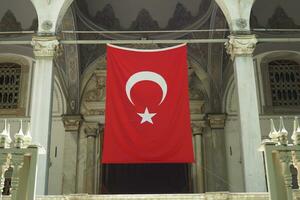 Turkish flag hanging on the window photo