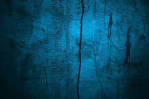 Blue wall Scary texture for background. Dark blue cracked cement photo