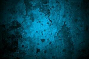 azul pared de miedo textura para antecedentes. oscuro azul agrietado cemento foto