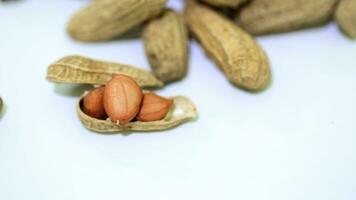 Peanuts, crunchy delights packed with flavor. A popular snack, rich in nutrients, enjoyed roasted or as a tasty ingredient in various dishes. photo