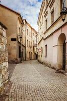 Narrow street of an old European city photo