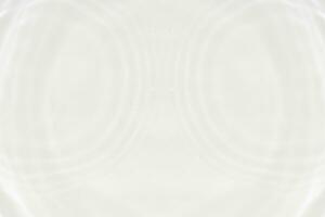 White water with ripples on the surface. Defocus blurred transparent white colored clear calm water surface texture with splashes and bubbles. Water waves with shining pattern texture background. photo