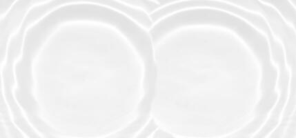 Defocus blurred transparent white colored clear calm water surface texture with splashes reflection. Trendy abstract nature background. Water waves in sunlight with copy space. Blue watercolor shine. photo