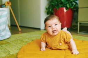 Tummy time for little baby, learning and development for little kids photo