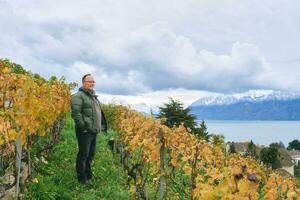 Outdoor portrait of middle age 55 - 60 year old man enjoing nice autumn day in vineyards, healthy and active lifestyle photo