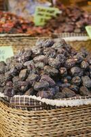 many date fruits display for sale at local market photo