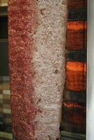 rotating traditional gyros meat close up photo