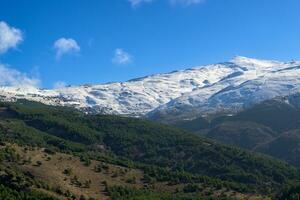 Ski slopes of Pradollano ski resort in Sierra Nevada mountains in Spain photo