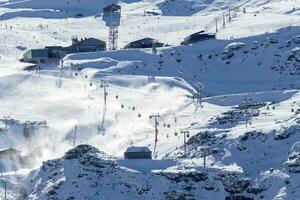 chairlifts, gondolas, ski lifts to the slopes of the ski resort in sierra nevada photo