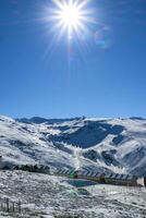 panoramic view of sierra nevada, hotels and high performance sports center in the mountains photo