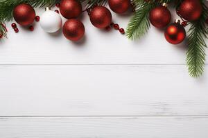 Festive winter scene featuring a flat lay of gifts, fir tree branches, and red decorations on a white background. photo