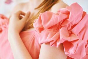 Fashion details, voluminous linen sleeve of pink coral dress photo