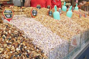 Turkey istanbul 19 june 2023, close up of many mixed nuts selling at market photo