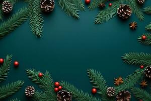 A festive array of yuletide foliage atop a blue hue with plenty of room for text. photo