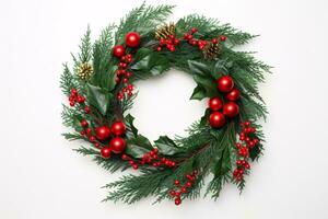 A festive wreath atop a pristine white surface, arranged from an overhead perspective with ample negative space. photo