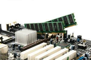 Desktop motherboard with RAM memory on a white background photo