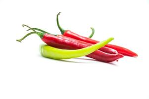 Red and green chili peppers on a white background photo