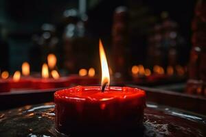 ai generado rojo vela ardiente en un templo foto