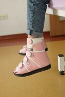 Child cerebral palsy disability, legs orthosis. photo