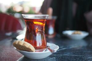 Traditional turkish tea on white table . photo